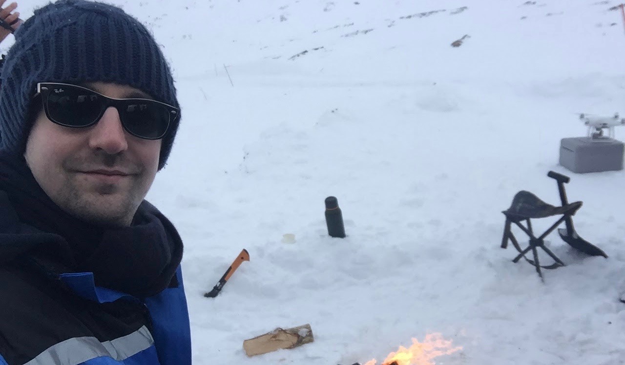 David sitting with camfure in the snow